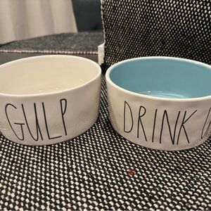 Two Rae Dunn dog bowls